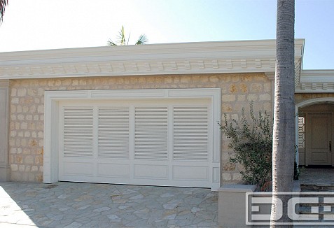 Coastal Custom Garage Doors Designed In A Louvered Shutter Style Dynamic Garage Door Projects